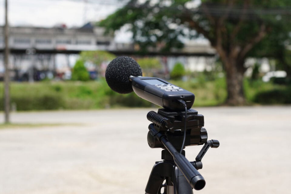 Measuring The Noise On The Road With A Sound Level Meter. Sound Level Meters Are Commonly Used In Noise Pollution Studies.